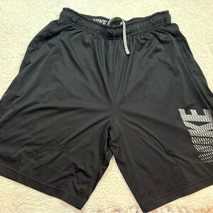 Nike Men's Black Athletic Shorts with Silver Accents | Nike on upper left leg